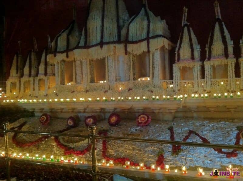 Shatrunjaya Taleti decorated with flowers and lit with diyas at night