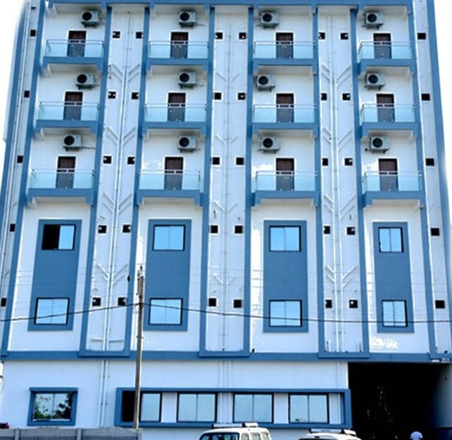 Front elevation of Jainsite Bhavan with air-conditioned rooms and glass balconies
