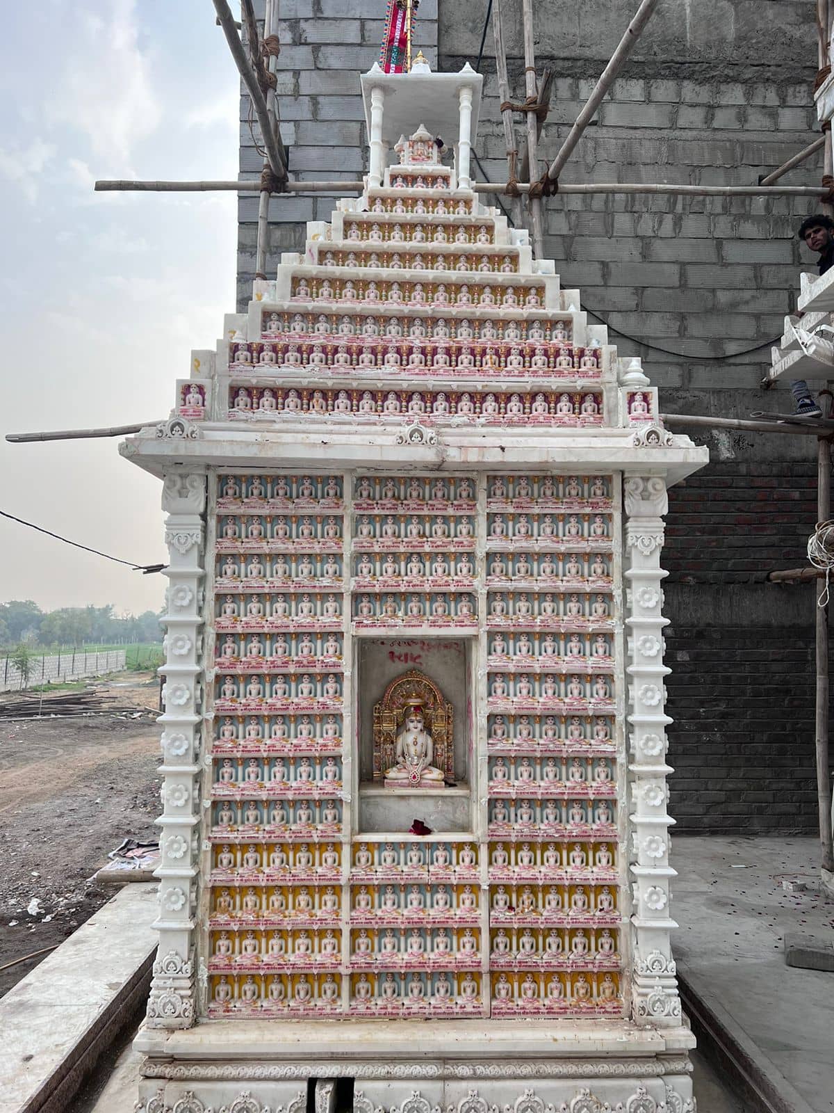Sahastrakoot Jinalay in white marble carved with 1024 pratimas around a central idol
